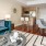 bright living room open to dining area